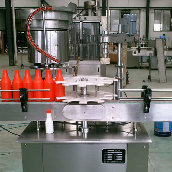 Автоматическая подача и закручивание (обкатка) крышек