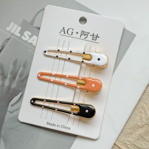 Коричневые зажимы-уточки с капельным точечным рисунком