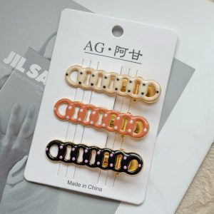 Коричневые зажимы-уточки с капельным точечным рисунком