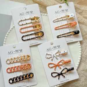 Коричневые зажимы-уточки с капельным точечным рисунком