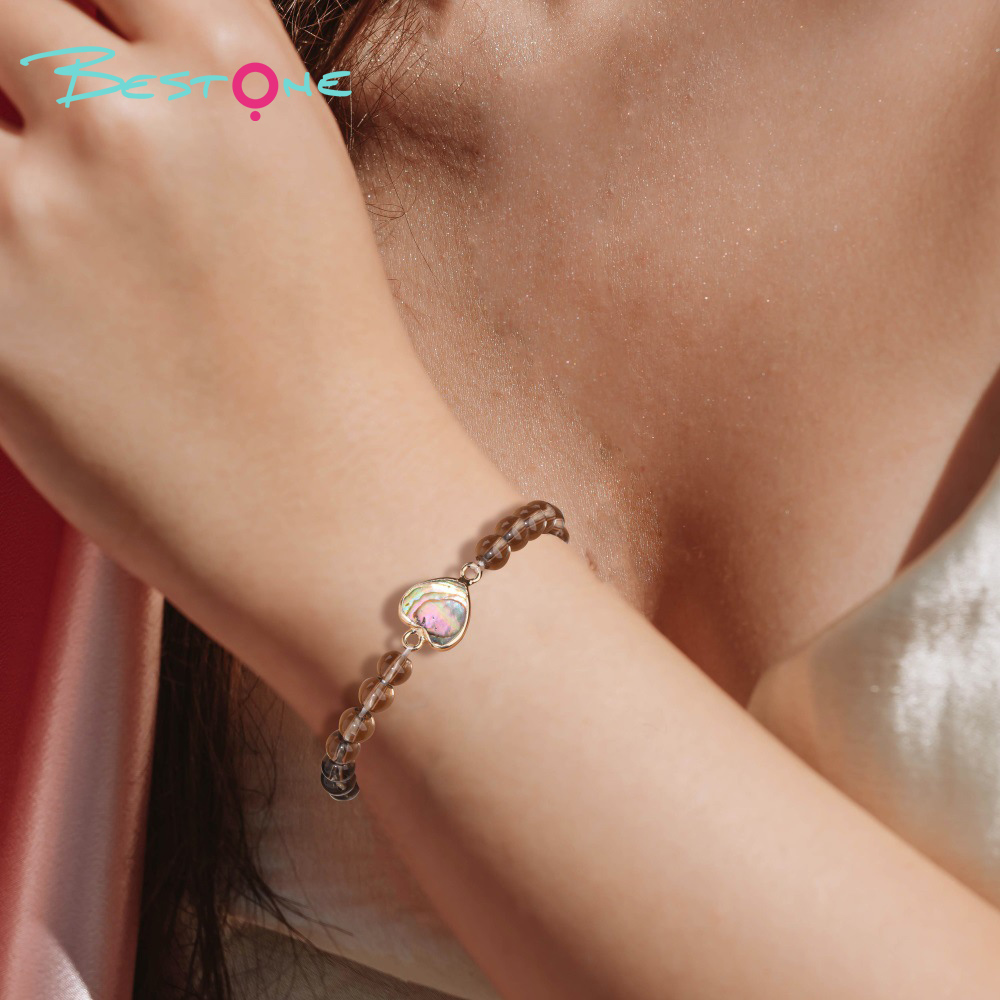 Браслет из раухтопаза 6 мм с вставками из перламутра абалон, на эластичной нити